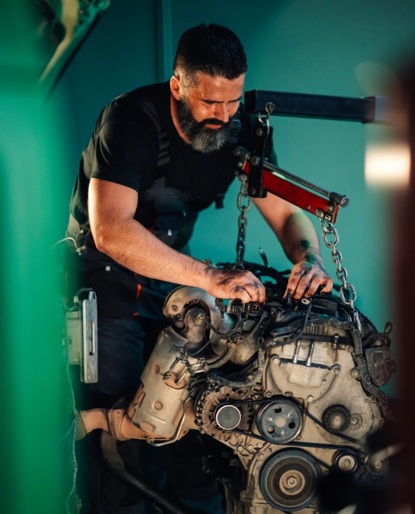 Detailed mechanical repairs by a mechanic in the night garage
